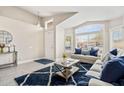 Open concept living room with neutral decor and stylish rug at 7365 E Adele Ct, Scottsdale, AZ 85255