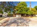 House exterior showcasing a spacious driveway and attached garage at 7622 N 7Th Ave, Phoenix, AZ 85021