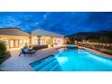 Stunning pool and spa with outdoor seating and lighting at 8519 E Regina Cir, Mesa, AZ 85207