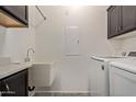 Laundry room with washer, dryer, and utility sink at 10960 E Monte Ave # 223, Mesa, AZ 85209