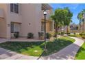 Landscaped pathway leading to the building entrance at 11333 N 92Nd St # 2061, Scottsdale, AZ 85260