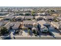 Two-story house situated in a residential neighborhood at 13611 W Merrell St, Avondale, AZ 85392