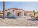 Bright white single story home with red tile roof and a covered entryway at 14103 W Casa Linda Dr, Sun City West, AZ 85375