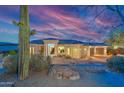 Stunning single-story home featuring desert landscaping, ample parking, and a tile roof at 15701 E Greystone Dr, Fountain Hills, AZ 85268