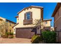 Three-story house with brown garage door and landscaping at 15913 S 11Th Way, Phoenix, AZ 85048