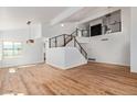 Bright living room with hardwood floors and modern staircase at 16414 N 48Th Way, Scottsdale, AZ 85254