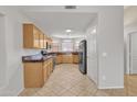 Kitchen with wood cabinets, granite countertops, and stainless steel appliances at 20902 N 36Th Pl, Phoenix, AZ 85050