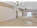 Bright and airy living area with tile flooring and views to kitchen at 20902 N 36Th Pl, Phoenix, AZ 85050