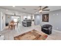 Bright and airy living room with tile floors and ceiling fan at 2641 W Wethersfield Rd, Phoenix, AZ 85029