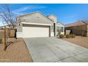 Gray single story house with two-car garage and drought-tolerant landscaping at 29402 W Mitchell Ave, Buckeye, AZ 85396