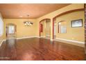 Formal dining room showcasing hardwood floors and access to other rooms at 29606 N 21 Dr, Phoenix, AZ 85085