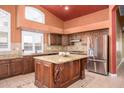 Spacious kitchen with island, stainless steel appliances, and granite countertops at 29606 N 21 Dr, Phoenix, AZ 85085