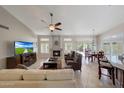 Spacious living room with fireplace, vaulted ceilings and lots of natural light at 3439 E Topeka Dr, Phoenix, AZ 85050