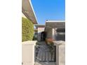 Home exterior featuring a gated entryway and a well-maintained landscape at 350 W Yellowstone Way, Chandler, AZ 85248