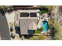 Aerial view of a private backyard with a sparkling pool, hot tub, and patio area perfect for entertaining at 3652 N Sonoran Hts, Mesa, AZ 85207