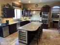 Gourmet kitchen featuring granite countertops, double oven, and wine cooler at 3652 N Sonoran Hts, Mesa, AZ 85207