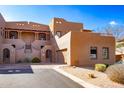 Two-story stucco home with private entrance and parking at 36601 N Mule Train Rd # B40, Carefree, AZ 85377