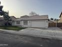 Newly remodeled home with a white exterior, two-car garage, and landscaped yard at 3743 W Shannon St, Chandler, AZ 85226