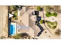 Birds-eye-view of a large residence with a pool, outdoor entertaining area, and circular driveway at 3791 E Vista Grande Dr, San Tan Valley, AZ 85140