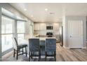 Modern kitchen with granite countertops, stainless steel appliances, and light-colored cabinetry at 3910 W Michigan Ave, Glendale, AZ 85308