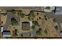 Aerial view showing a house with a large backyard and surrounding desert landscape at 44311 N 1St Dr, New River, AZ 85087