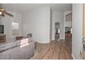 Spacious living room featuring hardwood floors, neutral walls, and an archway at 5184 W Del Rio St, Chandler, AZ 85226