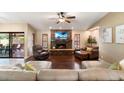 Relaxing living room with a stone fireplace and hardwood floors at 5213 W Soft Wind Dr, Glendale, AZ 85310