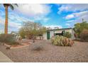 Charming one-story home with desert landscaping at 5720 E Cicero St, Mesa, AZ 85205