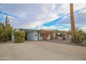 Front view of a ranch house with spacious yard at 5720 E Cicero St, Mesa, AZ 85205