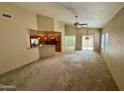 Spacious living room with high ceilings and carpet flooring at 5829 E Nora St, Mesa, AZ 85215