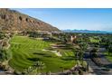 Aerial view of the golf course and resort community at 6000 E Camelback Rd # 7707, Scottsdale, AZ 85251