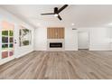 Modern living room with fireplace and wood accent wall at 7663 E Coolidge St, Scottsdale, AZ 85251