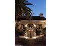 Elegant courtyard showcasing a beautiful water fountain and classic architecture at 8119 E Foothills Dr, Scottsdale, AZ 85255