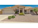 Light beige house with tile roof, two-car garage, and drought-tolerant landscaping at 9555 W Escuda Dr, Peoria, AZ 85382