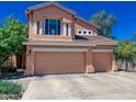 Charming two-story home featuring a three-car garage, a well-manicured front yard, and a classic design at 968 S Western Skies Dr, Gilbert, AZ 85296