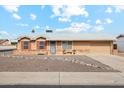 Ranch-style home with a landscaped yard and attached garage at 10572 W Echo Ln, Peoria, AZ 85345