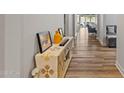 Bright entryway with wood-look floors and a console table at 11444 N Northfield St, Surprise, AZ 85388