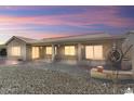 Covered back patio with ample space for outdoor seating and entertaining at 15406 W Pinchot Ct, Goodyear, AZ 85395