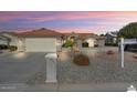 Lovely home featuring a two-car garage, tidy landscaping, and a 'Coming Soon' sign at 15406 W Pinchot Ct, Goodyear, AZ 85395