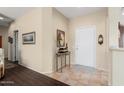 Bright entryway with tile flooring and a console table at 16203 W Starry Sky Dr, Surprise, AZ 85374