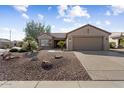 House exterior with gravel landscaping and a garage at 16203 W Starry Sky Dr, Surprise, AZ 85374