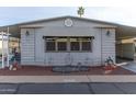 Neatly landscaped manufactured home with covered entryway at 205 S Higley Rd # 189, Mesa, AZ 85206