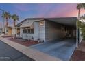 Mobile home with carport and partially covered entrance at 205 S Higley Rd # 189, Mesa, AZ 85206