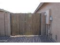 Wooden gate providing access to backyard at 2077 W Tanner Ranch Rd, San Tan Valley, AZ 85144