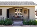 Cozy front porch with a seating area, perfect for relaxing and enjoying the outdoors at 305 W Lewis Ave, Phoenix, AZ 85003