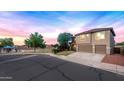 Charming two-story home featuring a three-car garage and well-maintained landscaping in a Gathering-friendly neighborhood at 32211 N Lepa Dr, San Tan Valley, AZ 85144