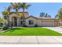 Two-story house with palm trees, a three-car garage, and a well-manicured lawn at 3503 E Princeton Ct, Gilbert, AZ 85234