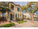 Two-story house with green accents and trees at 402 N 66Th Ln, Phoenix, AZ 85043