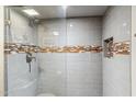 Updated shower with glass enclosure and stylish tile work at 4141 N 31St St # 215, Phoenix, AZ 85016