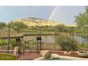 Enjoy a rainbow and mountain views from your patio at 41717 N Moss Springs Ct, Anthem, AZ 85086